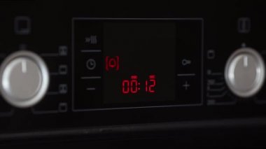 Countdown timer from 15 seconds on the electric panel of the oven