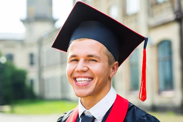 Portrait of a happy graduate male student - graduation concepts — Stock Photo, Image