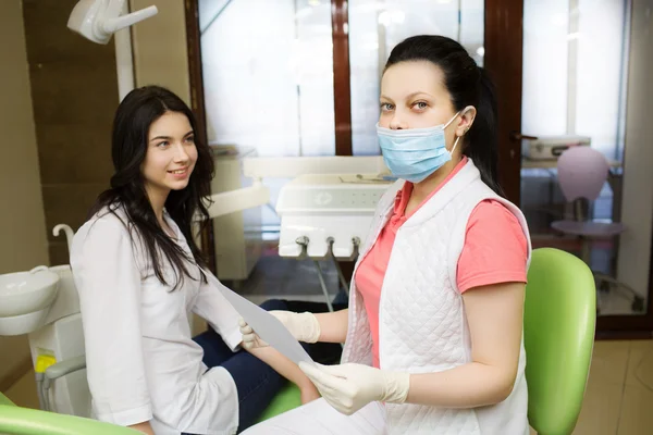 Woman dentist with patient — Stock Photo, Image