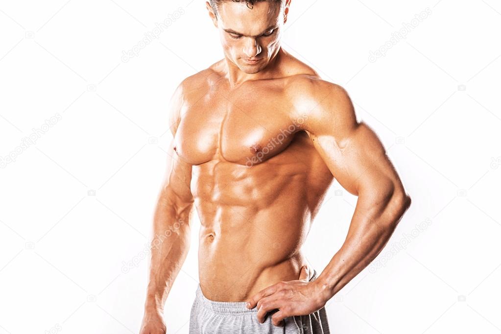 Strong Athletic Man looking at hand