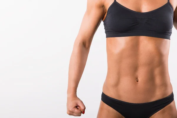 Bellissimo corpo da donna sportiva. Isolato su sfondo bianco — Foto Stock