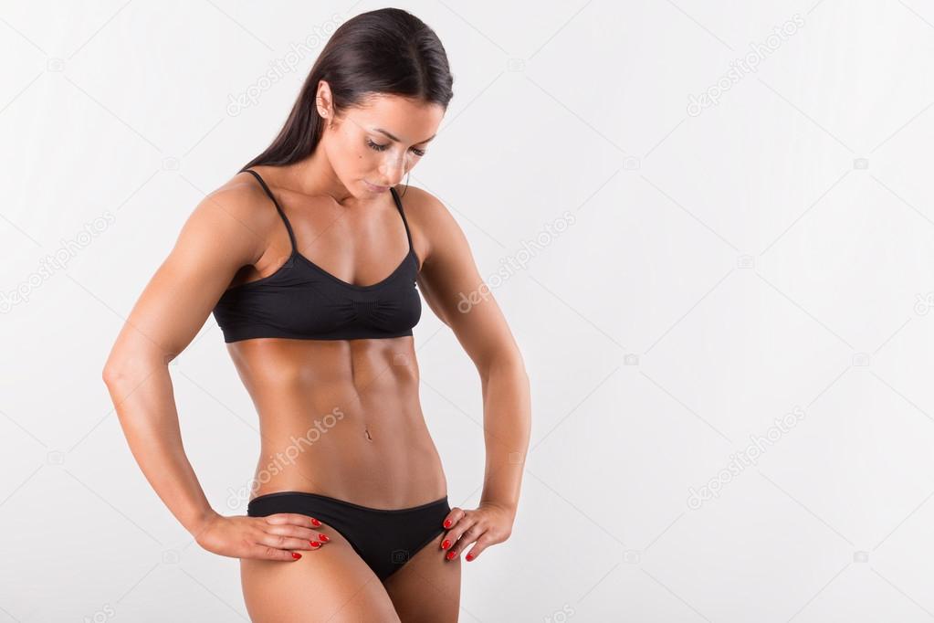 Beautiful sporty woman body. Isolated on white background