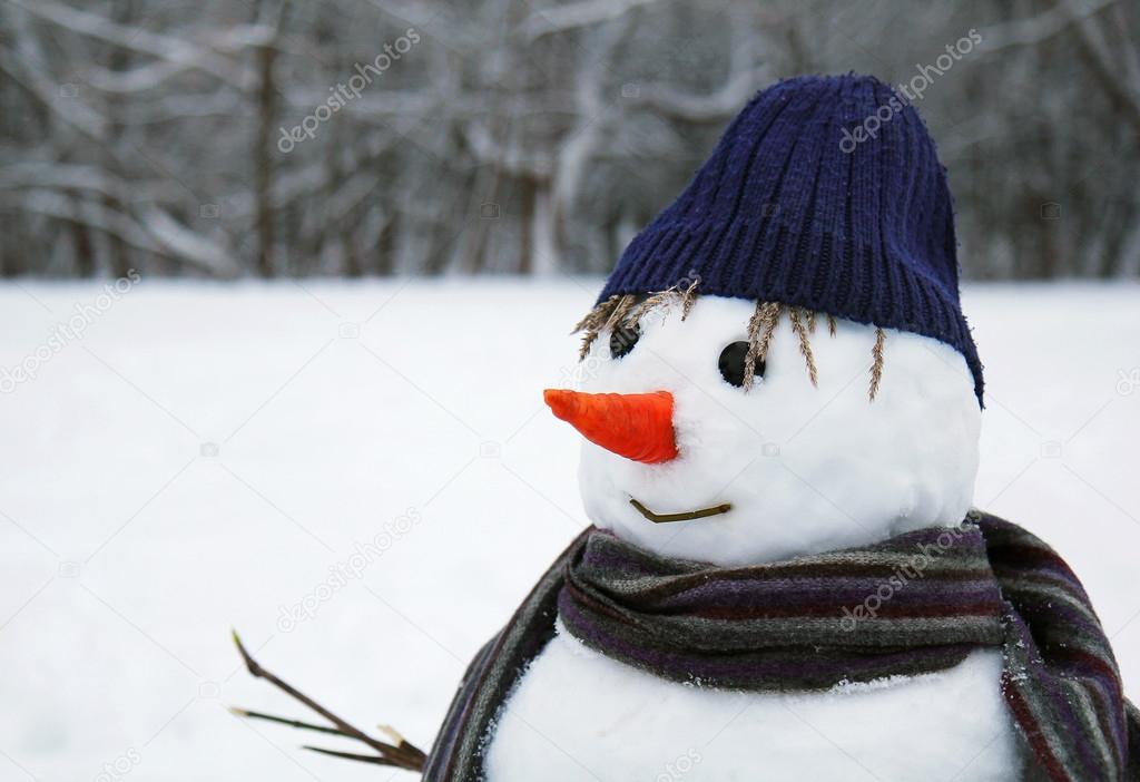 snow man standing close up