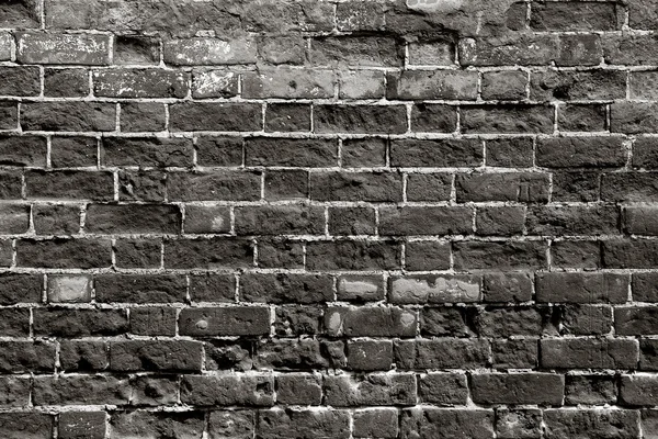 Old brick wall with dark bricks — Stock Photo, Image