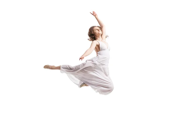 Young woman dancing in dress over white — Stock Photo, Image