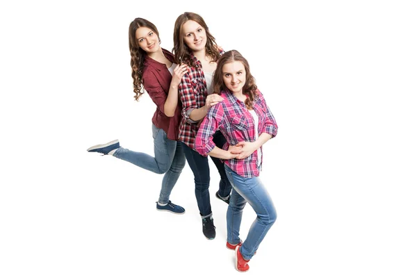 Three young women posing over white background — Stock Photo, Image