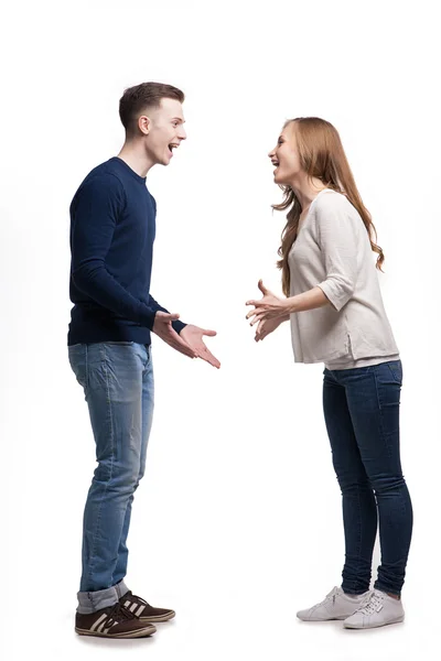 Young couple in fight against a white background — Stock Photo, Image