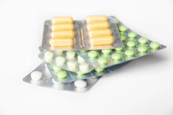 Close-up of green and white pills in blisters — Stock Photo, Image