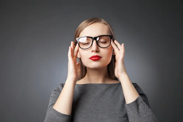 Woman in glasses with red lips meditating. eyes closed — Stock Photo, Image