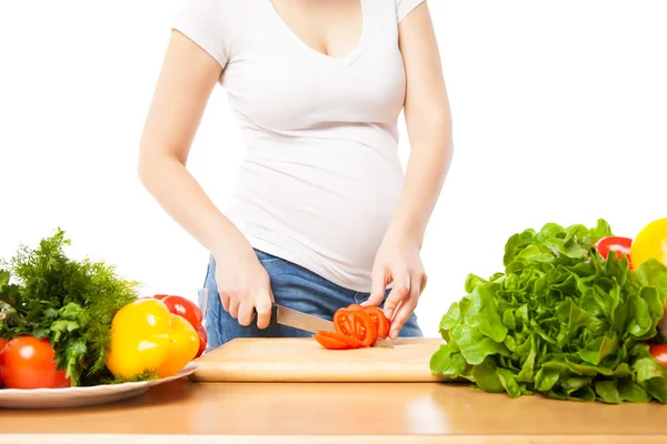 Unrecognizable woman cutting tomato Royalty Free Stock Images