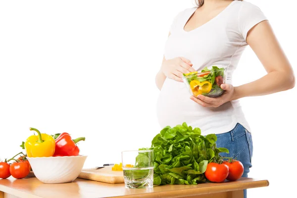 Close-up of pregnant woman holding bowl with fresh vegetables Stock Photo