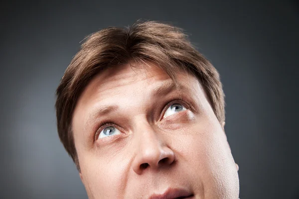 Curious adult man looking up — Stock Photo, Image