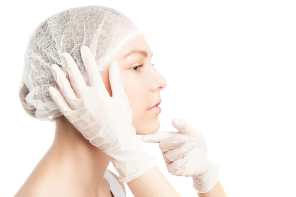 Unrecognizable person in gloves touching girls face — Stock Photo, Image