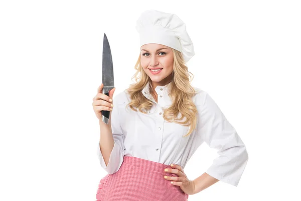 Hermosa mujer rubia en uniforme de chef con cuchillo — Foto de Stock