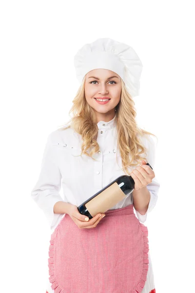 Schöne blonde Frau mit Hut und Schürze hält Flasche — Stockfoto