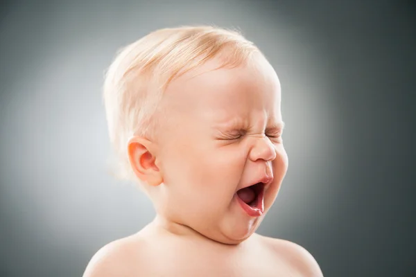 Baby with squint eyes and open mouth — Stock Photo, Image