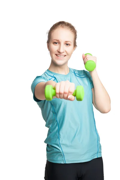 Atletische jonge vrouw werkt met groene halters — Stockfoto