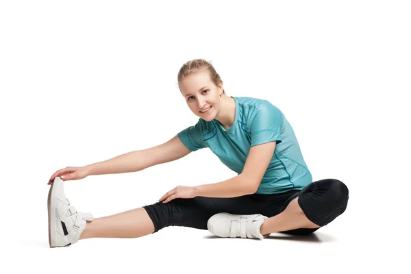 Hermosa mujer deportiva haciendo ejercicio en el suelo —  Fotos de Stock