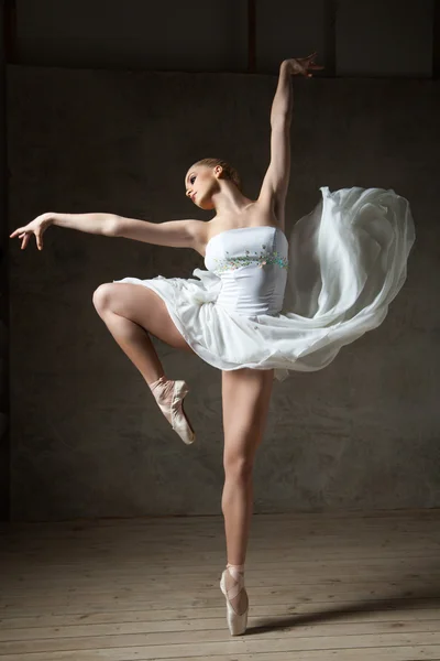 Beautiful ballerina dancing in white dress — Stock Photo, Image