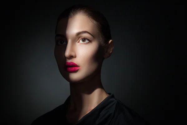 Attractive model with pink lips and shadow casting on face — Stock Photo, Image