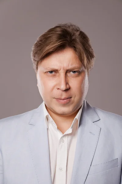 Angry Frowning Middle Age Man in Blue Jacket — Stock Photo, Image