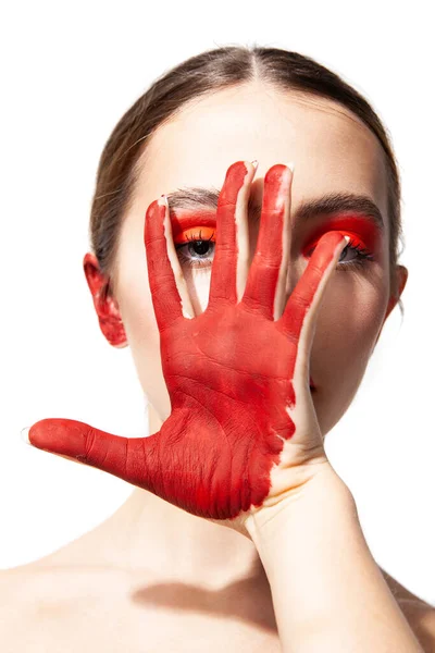 Woman with red makeup and painted hand — Stock Photo, Image