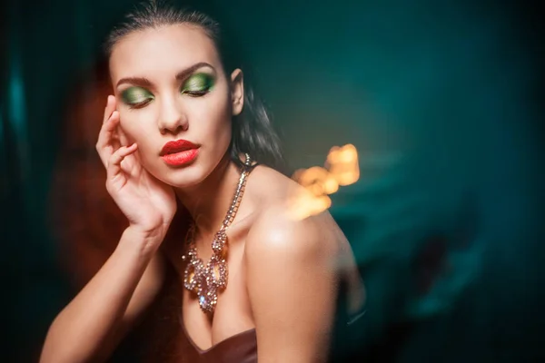 Beautiful woman with Jewelry over dark — Stock Photo, Image