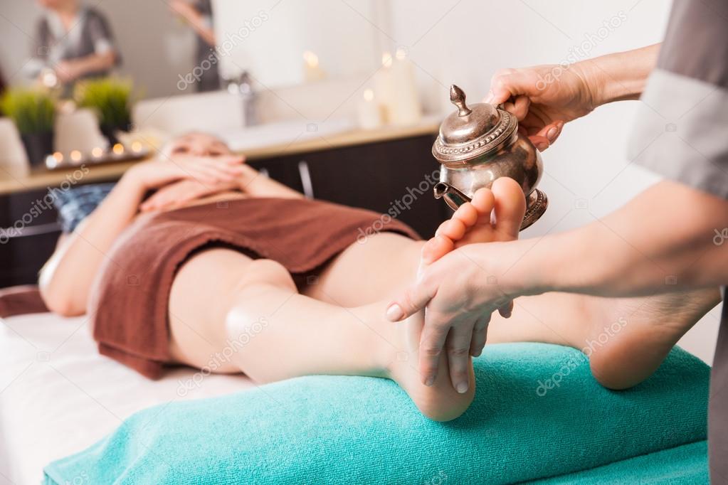 ayurvedic foot therapy massage procedure with oil