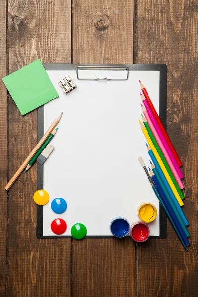 School supplies with blank on wooden background — Stock Photo, Image