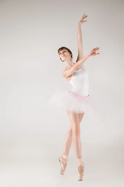 Ballet dancer in white tutu posing — Stock Photo, Image