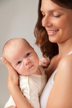 happy mother holding and hugging her baby