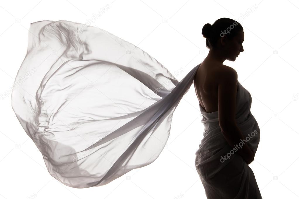 Beautiful pregnant woman in white chiffon shawl