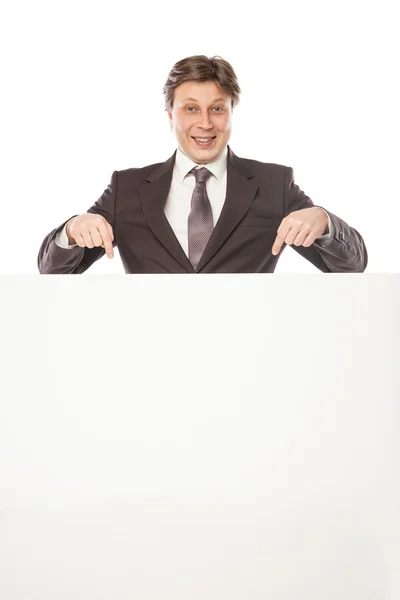 Business man holding empty board and pointing — Stock Photo, Image