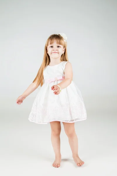 Little fashion girl in beautiful dress posing — Stock Photo, Image