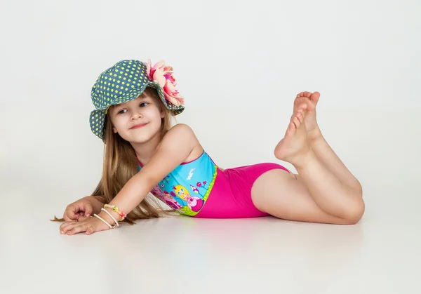 Little girls posing in swimsuits and hat — Stock Photo, Image