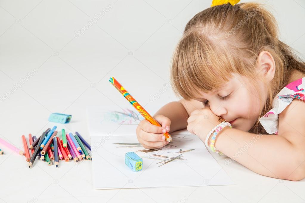lovely girl drawing with colorful pencils