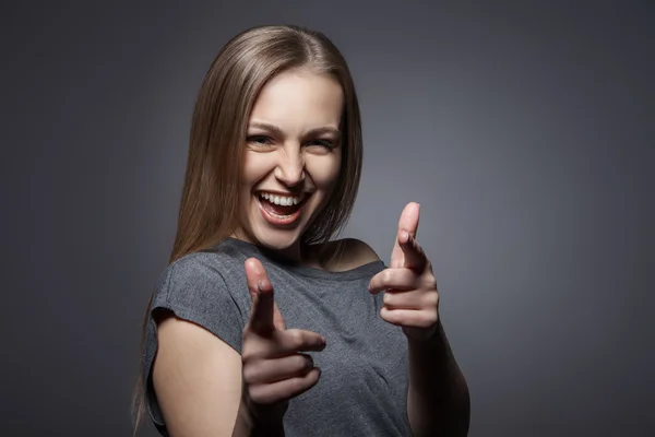 Smiling woman with okay gesture on dark grey — Stock Photo, Image