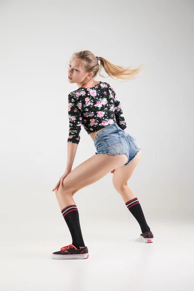 Beautiful booty dancer posing on studio background — Stock Photo, Image