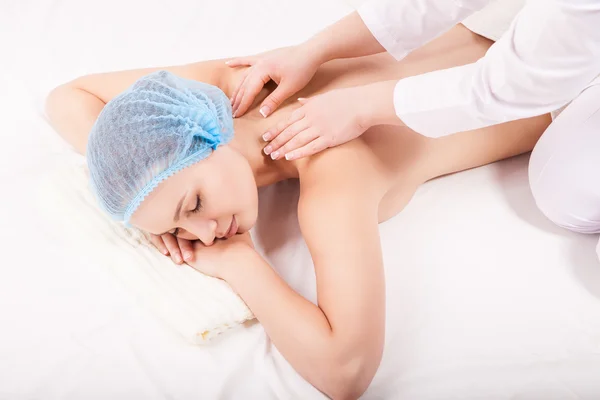 Portrait of young woman during massage procedure — Stock Photo, Image