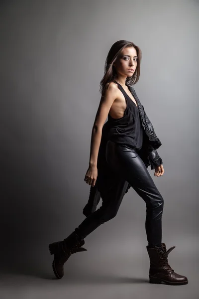 Fashion model wearing leather pants and jacket — Stock Photo, Image