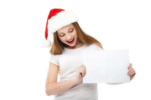 Jul kvinna i santa hatt pekar Tom kartong — Stockfoto