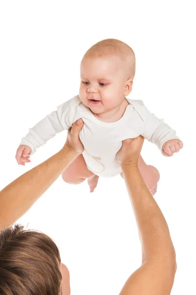 Szczęśliwy młody człowiek posiadający uśmiechający się dziecka na białym tle — Zdjęcie stockowe