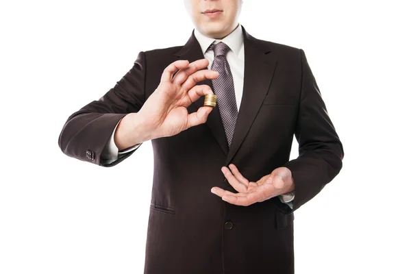 Businessman holding coins in his hand isolated — Stock Photo, Image