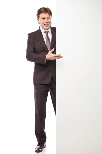 Man leaning against empty board isolated — Stock Photo, Image