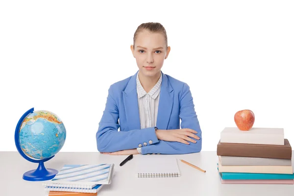 Young teen woman sitting behind the desk isolated — Stock Photo, Image