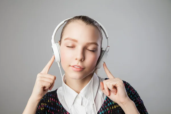 Girl in headphones with closed eyes and smile — Stock Photo, Image