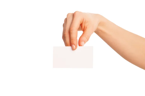 En la mano una hoja en blanco del papel blanco mostrado abajo — Foto de Stock