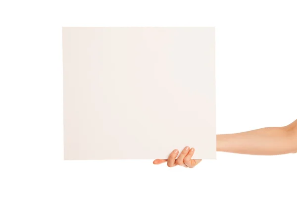 Na mão uma grande folha em branco de papel branco apareceu — Fotografia de Stock