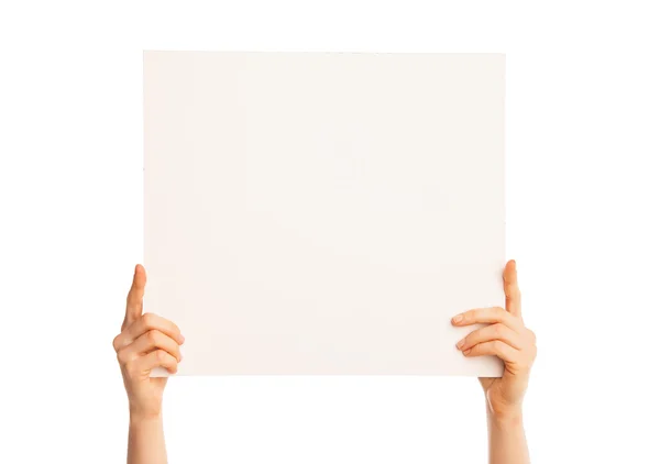 Isolated hands holding a big piece of paper — Stock Photo, Image