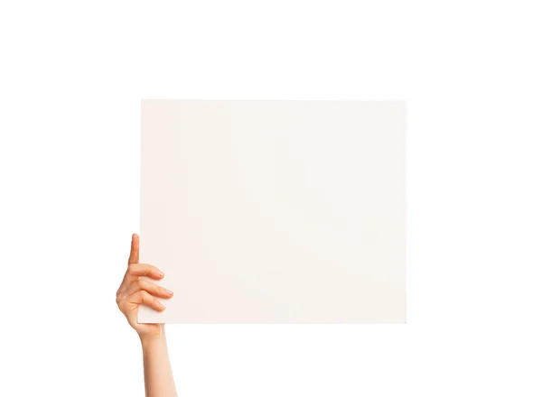 One hand holding a big white piece of cardboard. — Stock Photo, Image